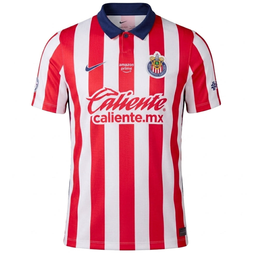A red and white vertically striped soccer jersey with a navy blue collar, featuring the Chivas crest, swoosh, and Caliente sponsor logo on the front.