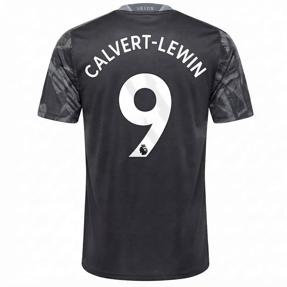 Back view of a Leeds United football jersey in black with 'CALVERT-LEWIN' and the number 9 printed in white on the back, featuring a subtle tonal pattern on the sleeves.