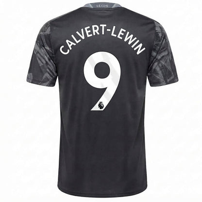 Back view of a Leeds United football jersey in black with 'CALVERT-LEWIN' and the number 9 printed in white on the back, featuring a subtle tonal pattern on the sleeves.