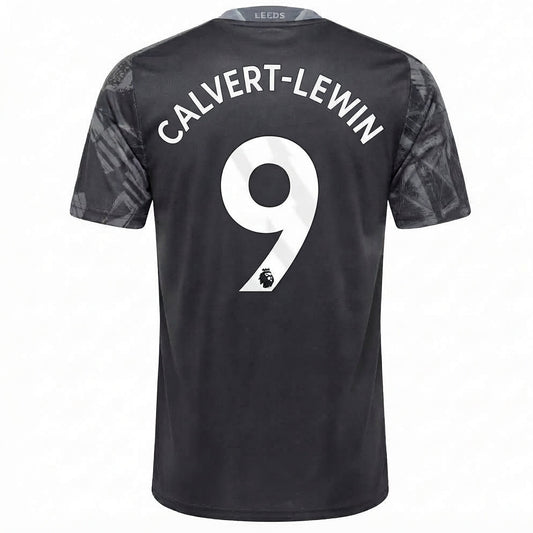 Back view of a Leeds United football jersey in black with 'CALVERT-LEWIN' and the number 9 printed in white on the back, featuring a subtle tonal pattern on the sleeves.