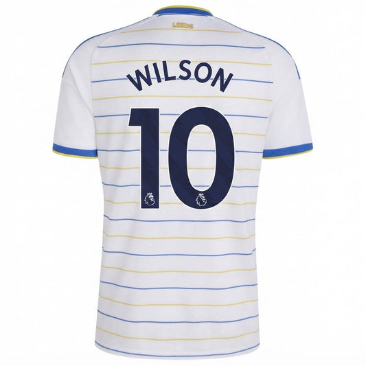 Back view of a white Leicester City football jersey with blue and yellow horizontal stripes, featuring the name 'WILSON' and number '10' in navy blue on the back.