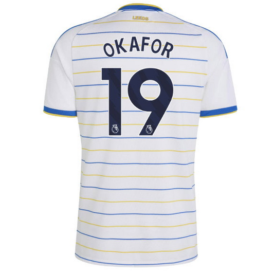 White Leeds United football jersey with blue and yellow horizontal stripes, featuring 'OKAFOR' and the number '19' printed on the back.