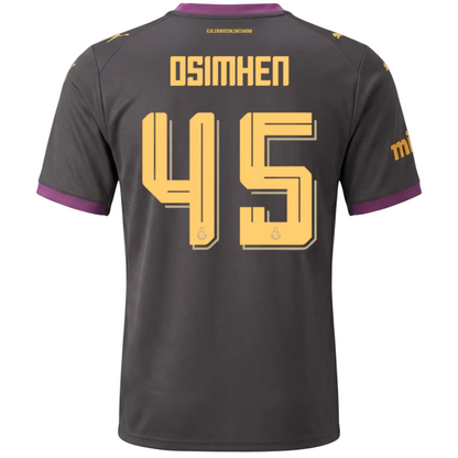 Back view of a dark gray soccer jersey with yellow 'OSIMHEN 45' lettering and purple sleeve trim, shown on a light gray background.
